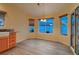 Cozy dining space featuring wood-look floors and natural light from surrounding windows at 3426 Side Saddle Ct, North Las Vegas, NV 89032