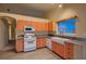 Bright kitchen featuring updated appliances, granite countertops, eat-in area, and a window view at 3426 Side Saddle Ct, North Las Vegas, NV 89032