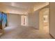 Expansive living area featuring neutral tones, high ceilings, and open floor plan at 3426 Side Saddle Ct, North Las Vegas, NV 89032