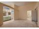 Spacious main bedroom featuring carpeting, walk-in closet, and an ensuite bathroom at 3426 Side Saddle Ct, North Las Vegas, NV 89032