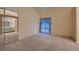 Bright main bedroom featuring carpeting, a sliding glass door, a mirrored closet and attached bathroom at 3426 Side Saddle Ct, North Las Vegas, NV 89032