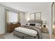 Cozy bedroom with neutral tones, a large window, and closet with mirrors at 3455 Erva St # 112, Las Vegas, NV 89117