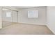 Spacious bedroom with mirrored closet doors and a large window at 3455 Erva St # 112, Las Vegas, NV 89117