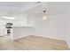 Open floorplan dining area featuring hardwood flooring, kitchen bar, and recessed lighting at 3455 Erva St # 112, Las Vegas, NV 89117