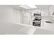 Well-lit kitchen with stainless steel appliances and bright white cabinetry at 3455 Erva St # 112, Las Vegas, NV 89117