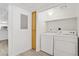 Convenient laundry area with washer, dryer, and storage space, seamlessly connected to the kitchen at 3455 Erva St # 112, Las Vegas, NV 89117