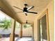 Covered back patio with ceiling fans and access to the yard through sliding glass doors at 3809 Van Ness Ave, North Las Vegas, NV 89081