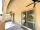 Covered back patio with access to the yard through sliding glass doors at 3809 Van Ness Ave, North Las Vegas, NV 89081