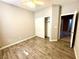This bedroom features stylish wood floors, a ceiling fan, and a convenient closet for ample storage at 3809 Van Ness Ave, North Las Vegas, NV 89081