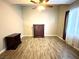This spacious bedroom features wood floors, ceiling fan, and natural light from the window at 3809 Van Ness Ave, North Las Vegas, NV 89081