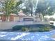 Attractive community entrance sign with beautiful landscaping and inviting street view at 3809 Van Ness Ave, North Las Vegas, NV 89081