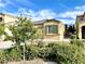 Inviting single-Gathering home with desert landscaping, neutral tones, and a well-manicured lawn at 3809 Van Ness Ave, North Las Vegas, NV 89081