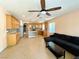 Bright, open kitchen adjacent to living area, stainless appliances, island, and sleek design at 3809 Van Ness Ave, North Las Vegas, NV 89081