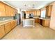Bright kitchen with stainless steel appliances, a functional center island, and generous counter space at 3809 Van Ness Ave, North Las Vegas, NV 89081