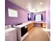 Bright laundry room with washer, dryer, storage cabinets, counter space, and natural light at 3809 Van Ness Ave, North Las Vegas, NV 89081