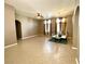 Spacious living area featuring neutral tones, tile floors, and an elegant dining set at 3809 Van Ness Ave, North Las Vegas, NV 89081