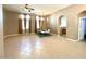 Bright living room with an open floor plan, tile flooring, and access to other living spaces at 3809 Van Ness Ave, North Las Vegas, NV 89081