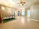 Open-concept living room boasts tile flooring and natural light, flowing into the dining area at 3809 Van Ness Ave, North Las Vegas, NV 89081