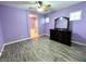 Stylish main bedroom with wood-look flooring and ensuite bath entrance; mirror dresser at 3809 Van Ness Ave, North Las Vegas, NV 89081
