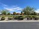 A colorful community park with playground equipment and shaded picnic area set against a blue sky at 3809 Van Ness Ave, North Las Vegas, NV 89081