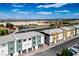 Scenic aerial view of townhomes, surrounding community ballfields and distant mountain views at 3880 Enchanted Sky St, Las Vegas, NV 89129