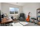 Sun-filled bedroom featuring a desk, reading chair, and views of the distant mountains at 3880 Enchanted Sky St, Las Vegas, NV 89129
