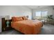Comfortable bedroom showcasing a large window offering views and featuring neutral walls and carpet at 3880 Enchanted Sky St, Las Vegas, NV 89129