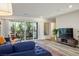 Comfortable living room with contemporary furnishings and sliding glass doors to a balcony, providing natural light at 3880 Enchanted Sky St, Las Vegas, NV 89129
