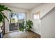Bright room with wood-look floors and sliding glass doors, perfect for indoor-outdoor living at 3880 Enchanted Sky St, Las Vegas, NV 89129
