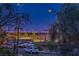 Scenic night view featuring city skyline and full moon over parking lot at 3880 Enchanted Sky St, Las Vegas, NV 89129