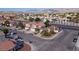 Aerial view of neighborhood with well maintained landscaping and palm tree lined streets at 3913 Lilac Haze St, Las Vegas, NV 89147