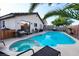 Stunning backyard pool and spa area with lounge seating, perfect for relaxation and entertainment at 3913 Lilac Haze St, Las Vegas, NV 89147