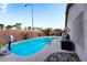 Backyard features a refreshing pool, palm trees, and ample patio space for outdoor enjoyment at 3913 Lilac Haze St, Las Vegas, NV 89147