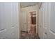 Bathroom entrance with tile flooring, white doors and a shower at 3913 Lilac Haze St, Las Vegas, NV 89147