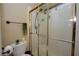 A bathroom view with a glass-doored shower and natural lighting at 3913 Lilac Haze St, Las Vegas, NV 89147