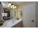 Bright bathroom with a large mirror, ample counter space, and modern lighting fixtures at 3913 Lilac Haze St, Las Vegas, NV 89147