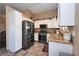 Well-lit kitchen features stainless steel appliances, granite countertops, and tile flooring at 3913 Lilac Haze St, Las Vegas, NV 89147