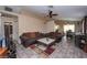 Comfortable living room with tile flooring, a ceiling fan, and views of the dining area, creating a relaxing atmosphere at 3913 Lilac Haze St, Las Vegas, NV 89147