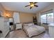 Bedroom with natural light, tile floors, ceiling fan and neutral color scheme at 3913 Lilac Haze St, Las Vegas, NV 89147