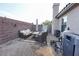Outdoor patio features stylish furniture, a dining area, and a privacy wall with decorative string lights at 3913 Lilac Haze St, Las Vegas, NV 89147