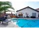 Inviting backyard pool and spa, with ample lounge area and barbecue, perfect for outdoor entertaining at 3913 Lilac Haze St, Las Vegas, NV 89147