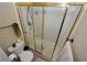 Enclosed shower stall with glass doors, bright tile, and convenient fixtures in a well-kept bathroom at 3913 Lilac Haze St, Las Vegas, NV 89147