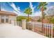 Exterior view from balcony with palm trees, a white railing, and blue sky at 404 Via Sonador, Henderson, NV 89012