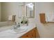 Well-lit bathroom featuring double mirrors, white countertops, and decorative hand towels at 404 Via Sonador, Henderson, NV 89012