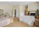 Bedroom with a large dresser, entertainment center, and a sitting area with a patterned cover at 404 Via Sonador, Henderson, NV 89012