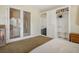 Bedroom featuring a closet with built-ins, carpet and French doors leading outside at 404 Via Sonador, Henderson, NV 89012
