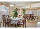 Spacious formal dining room featuring chandelier and large windows with decorative valances for lots of natural light at 404 Via Sonador, Henderson, NV 89012