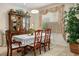Formal dining area boasts a chandelier and large china cabinet for sophisticated storage and display at 404 Via Sonador, Henderson, NV 89012