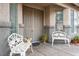 Welcoming front entrance with double doors, decorative benches, and charming architectural details at 404 Via Sonador, Henderson, NV 89012