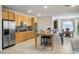 Spacious kitchen with stainless steel appliances, custom cabinets, and an adjacent dining area at 404 Via Sonador, Henderson, NV 89012